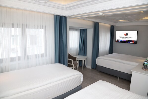 Deluxe Quadruple Room | Premium bedding, Tempur-Pedic beds, in-room safe, individually decorated - Novus Hotel (Istanbul)