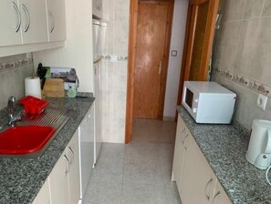 Fridge, oven, toaster, cookware/dishes/utensils