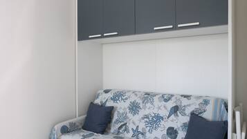 Comfort Studio | Desk, laptop workspace, blackout drapes, iron/ironing board