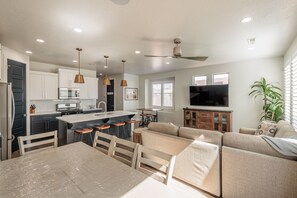 Enjoy a spacious open-plan living area with a kitchen, dining space, and comfortable seating.