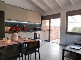 Superior Apartment, 1 Queen Bed with Sofa bed, Sea View, Mountainside | Private kitchen | Full-size fridge, oven, electric kettle, cookware/dishes/utensils