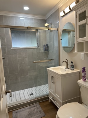 Shower, hair dryer, towels, soap - The Happy House, a quaint, fully remodeled home. (Sebring)