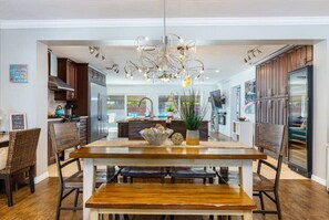 Enjoy cooking in this well-equipped kitchen with a central island, oven, and dining area.