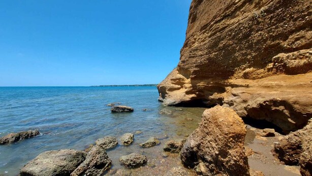 A coastal landscape with clear blue water, rocky formations, and a cliff. - Lovely 1 bedroom, 2 Guest +, holiday rentals in St Thomas Jamaica  (Port Morant)