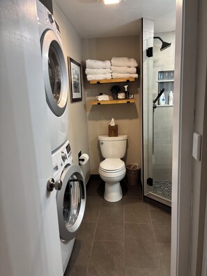 Shower, hair dryer, towels, soap