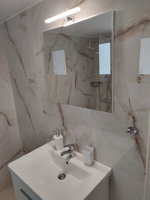 Shower, hair dryer, towels, soap