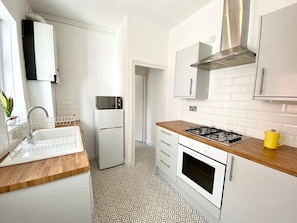 Fridge, microwave, stovetop, cookware/dishes/utensils