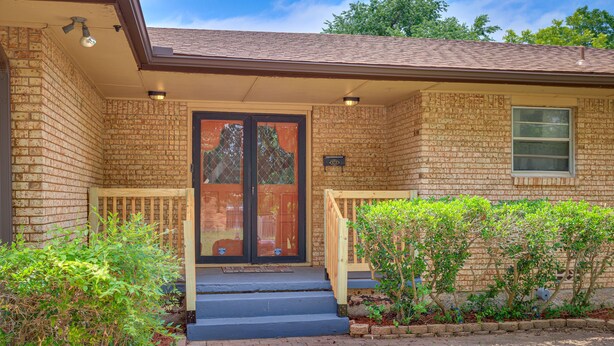 A brick house with a front door, a small porch, and a window. - Lawton Home w/ Deck, Near Casinos + Museums! (Lawton)