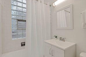 Shower, hair dryer, towels - Newly Updated Vintage 6 Bedroom Single Family Home by AllSet Turnover (Chicago)