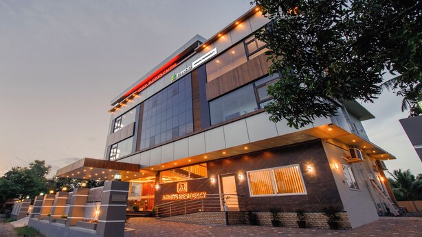 A modern building with a sign reading "Amigos Residency." - Treebo Amigos Residency Cochin Airport Hotel (Aluva)