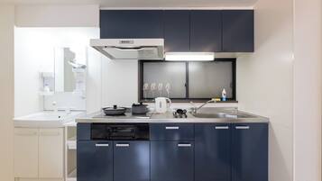 City Apartment | Living area | 32-inch flat-screen TV with digital channels