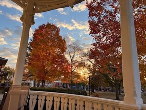 A gazebo with a white balustrade overlooking a park with autumn-colored trees. - Historic mansion, 6 guests, free parking (Dubuque)