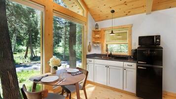 Fridge, microwave, coffee/tea maker, cookware/dishes/utensils