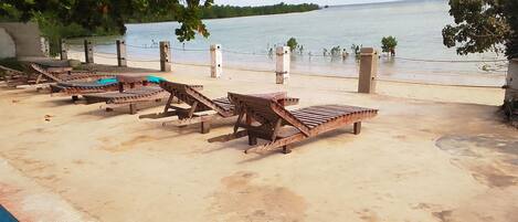 On the beach, black sand