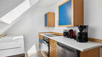 Fridge, stovetop, dishwasher, coffee/tea maker