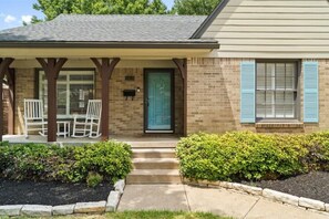 Welcome to this charming home with a front porch and beautifully maintained gardens.