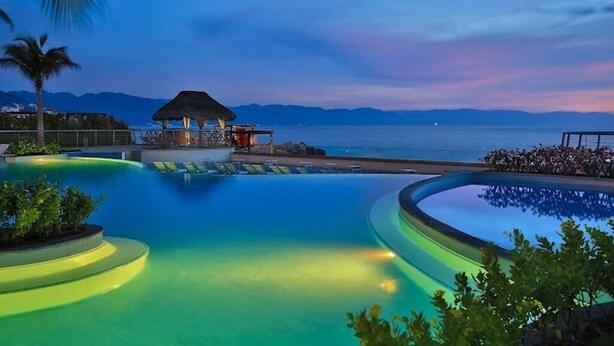 Outdoor pool, an infinity pool, sun loungers