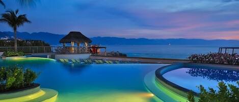 Outdoor pool, an infinity pool, sun loungers