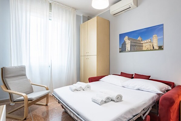 1 bedroom, desk, iron/ironing board, travel crib
