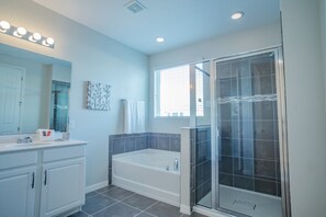 Combined shower/tub, hair dryer, towels, soap