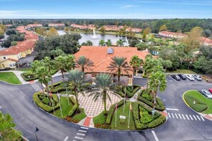 Surrounded by lush gardens and a tranquil body of water, this serene retreat offers a peaceful escape.