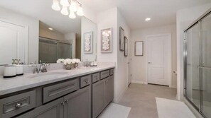 Shower, hair dryer, towels, toilet paper