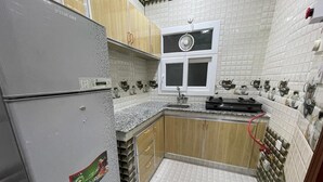 Basic Double or Twin Room, 2 Bedrooms, Accessible | Private kitchen | Fridge, oven - almazarbuilding (Salalah)