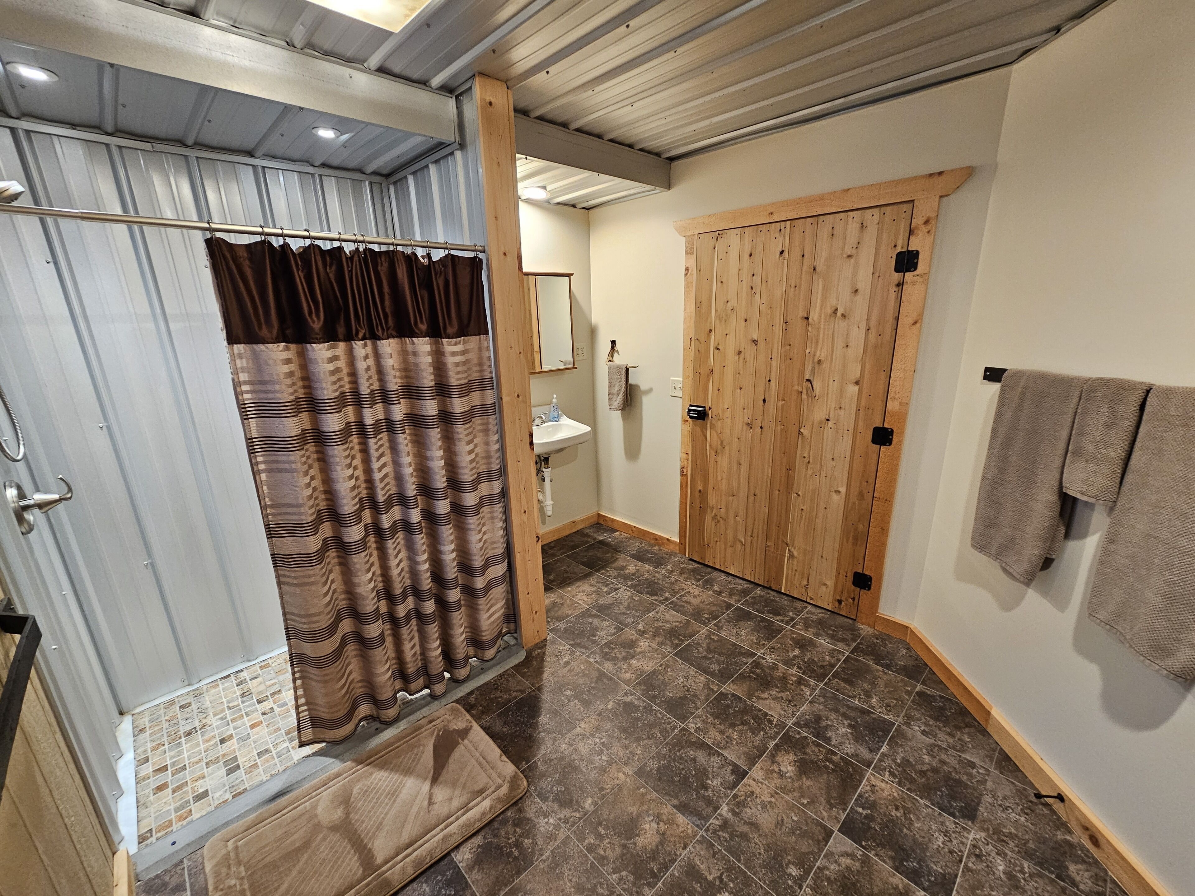Shower, towels, soap, toilet paper