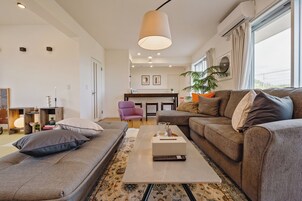 Deluxe House | Living area | Flat-screen TV