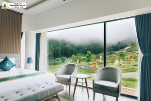 Premium bedding, free minibar items, desk, laptop workspace