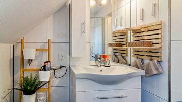 Shower, free toiletries, hair dryer, towels