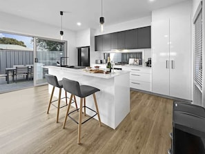 Fridge, microwave, oven, stovetop - Village Seaside Retreat - Modern, Walk to Beach (Shellharbour)
