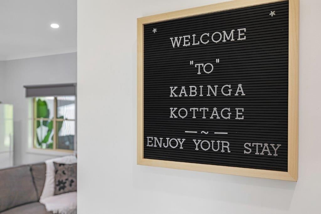 A welcome sign for Kabingga Cottage with a simple, clean design.