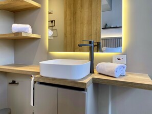 Shower, heated floors, towels, soap
