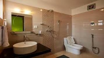 Shower, rainfall showerhead, towels, soap