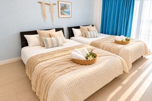 A hotel room with two beds, a large window with blue curtains, and a wall-mounted macrame decoration. - Grandioso Okinawa Pool Villa Kin 2 (Kin)