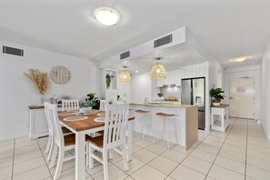 Enjoy cooking in the well-equipped kitchen with a stove and central island.