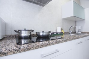 Oven, dishwasher, coffee/tea maker, cookware/dishes/utensils