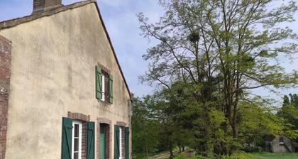 Maison autonome avec terrasse privative dans une ferme-moulin