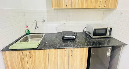 The Lodgers Luxury Studio Apartment In front of Artemis Hospital