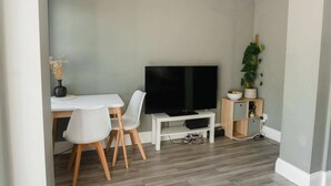 Basic Apartment, Multiple Beds | Living area | TV - Lovely 2BD Flat With Private Garden - Bounds Green (London)
