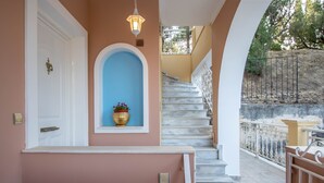 A staircase with marble steps leading to a balcony with a metal railing. - Andelica Holiday Villa (Zakynthos)