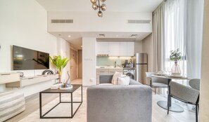 TV - Polished Studio at Mesk 1 Midtown Dubai Production City by Deluxe Holiday Homes (Dubai)