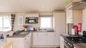 Fridge, electric kettle, toaster, cookware/dishes/utensils