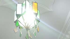 A staircase with a geometric chandelier, a potted plant, and a framed picture on the wall. - Appartement Spacieuse et Propre à Louer (Martil)
