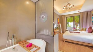 A modern hotel room with a bathtub, a large bed, and a view of the outdoors. - Wuzhen Dream Hotel (Jiaxing)