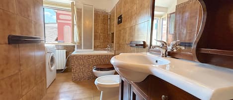 Hair dryer, bidet, towels, toilet paper