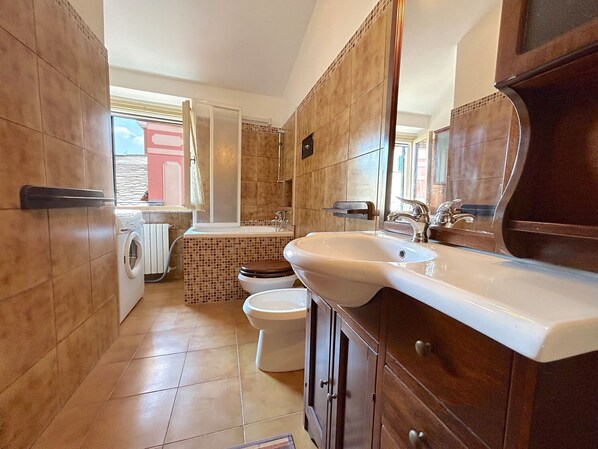 Hair dryer, bidet, towels, toilet paper