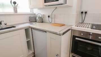 Fridge, electric kettle, toaster, cookware/dishes/utensils
