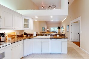 Fridge, microwave, oven, stovetop - 2nd-floor lakefront condo with heated pool, lake view, balcony, bikes, fast WiFi (Naples)